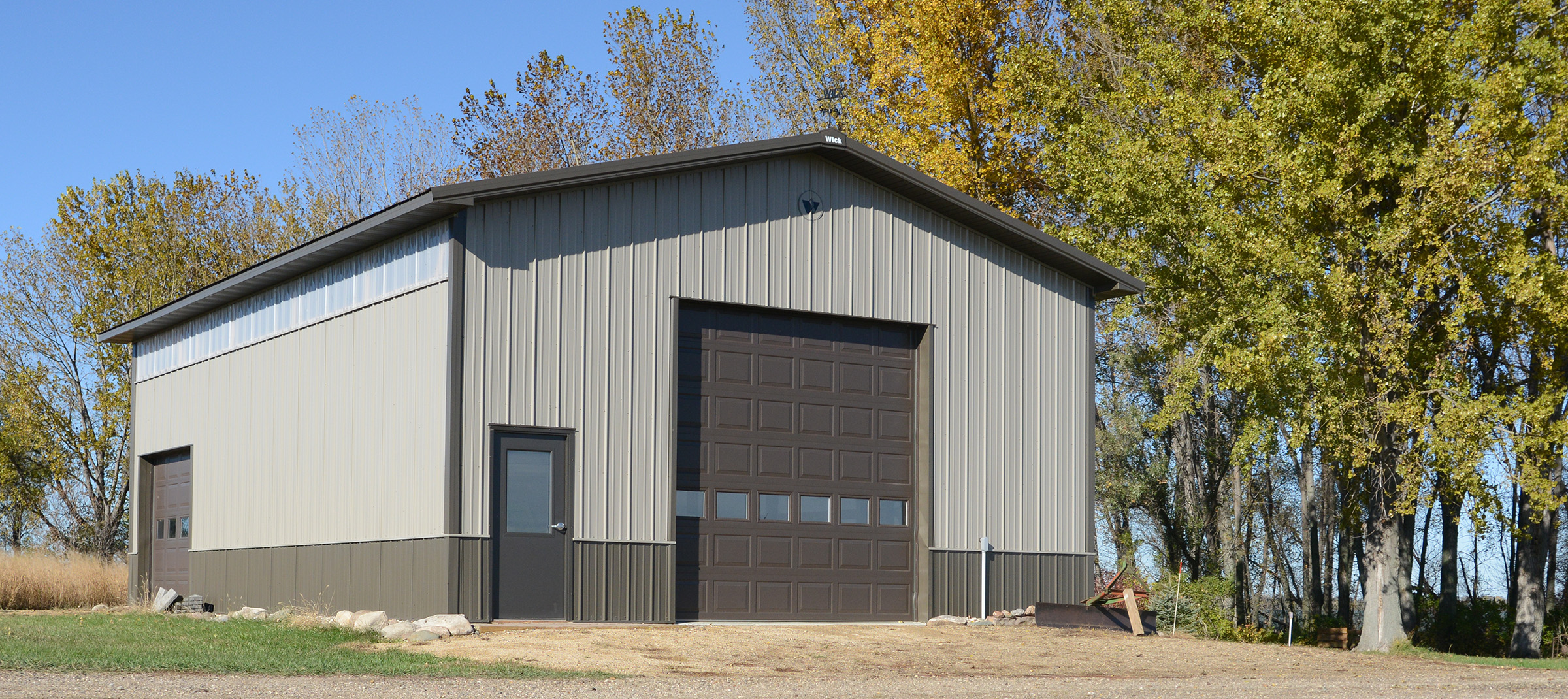 beige and olive green suburban post frame storage building